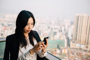 Asian Businesswoman Using Her Cellphone