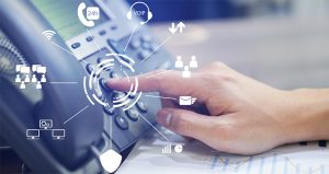 close up employee call center man hand point to press button number on telephone office desk with virtual communication technology concept